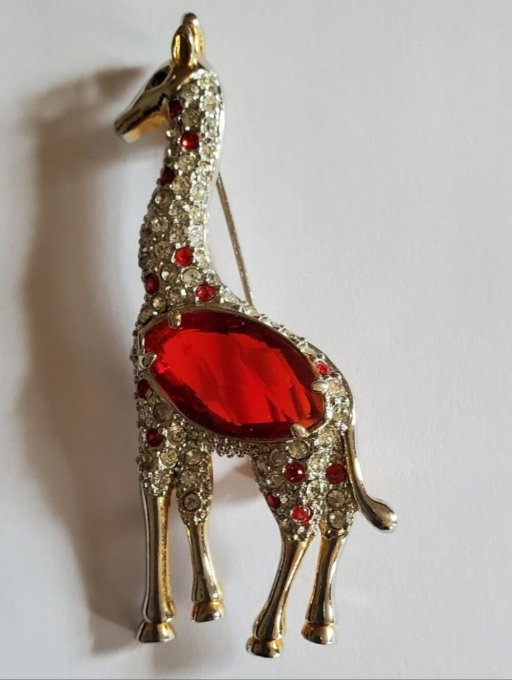 Gold Giraffe Brooch with Red Crystal Center